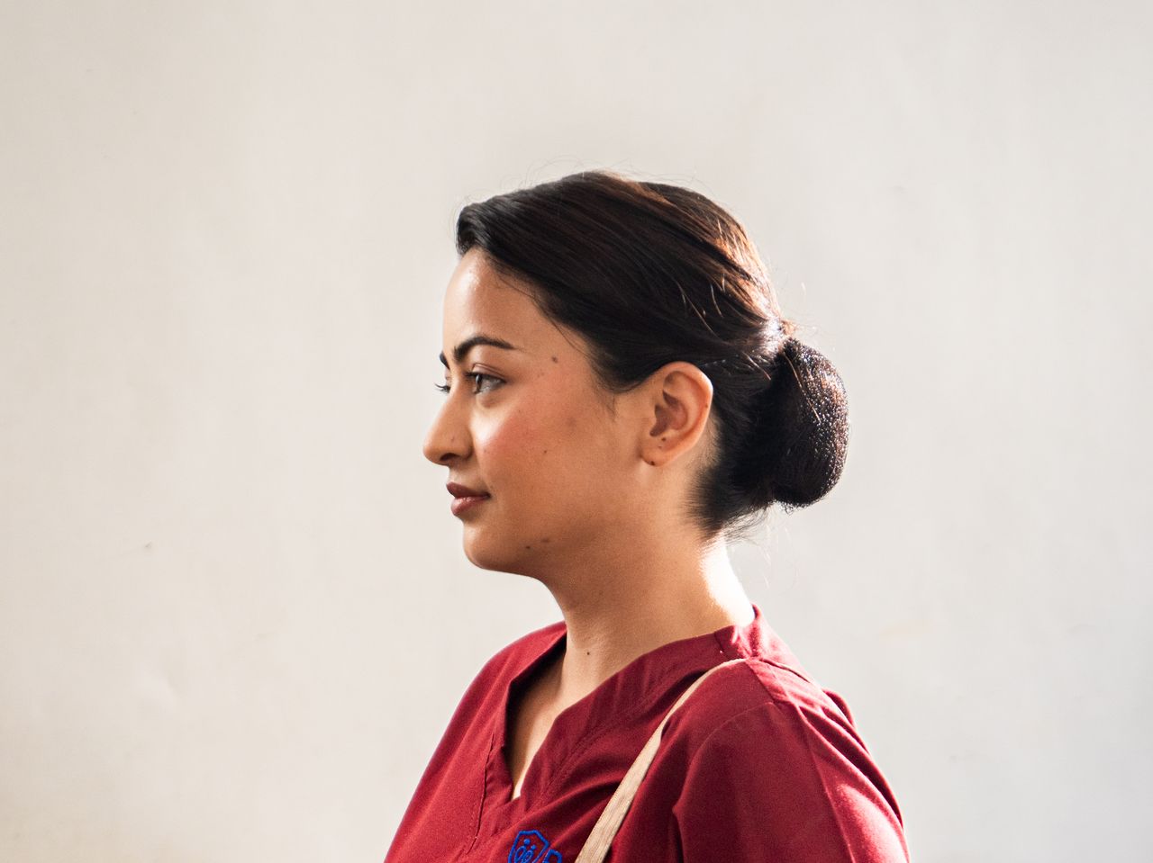 Confident Parivar nurse in uniform ready for a home visit